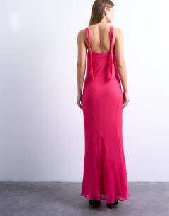 Model wearing Knot neck deep cowl occasion midi in fushcia pink