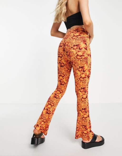 Topshop knot twist front flared trouser in hibiscus print