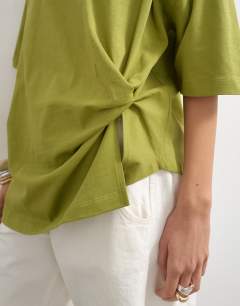 Model wearing Knot twist t-shirt in green