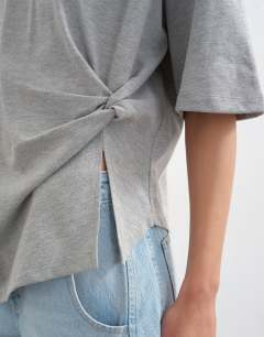 Model wearing Knot twist t-shirt in grey marl