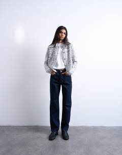 Model wearing Kort high rise straight jean in indigo rinse