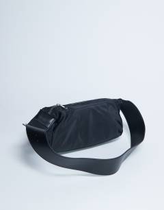 Model wearing Kylie nylon cross body with contrast strap in black