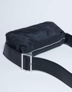 Model wearing Kylie nylon cross body with contrast strap in black