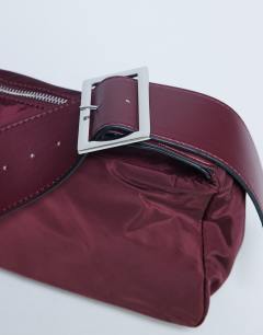 Model wearing Kylie nylon cross body with contrast strap in burgundy