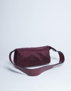 Model wearing Kylie nylon cross body with contrast strap in burgundy