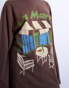 Model wearing La Marais graphic skater tee in brown
