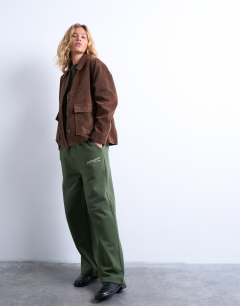 Model wearing La paloma embroidered straight jogger co-ord in green