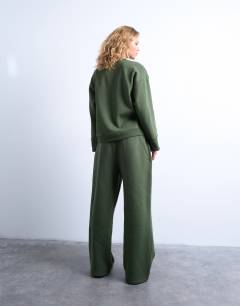 Model wearing La paloma embroidered straight jogger co-ord in green