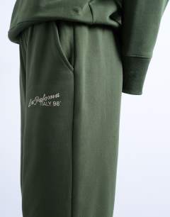 Model wearing La paloma embroidered straight jogger co-ord in green
