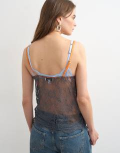 Model wearing Lace cami top in grey with orange tipping
