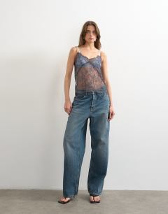 Model wearing Lace cami top in grey with orange tipping