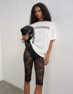 Model wearing Lace capri legging hosiery in black