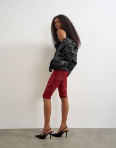 Model wearing Lace capri legging hosiery in burgundy