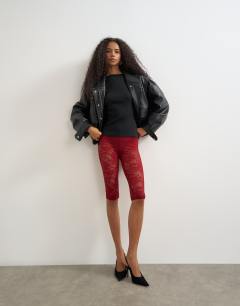 Model wearing Lace capri legging hosiery in burgundy