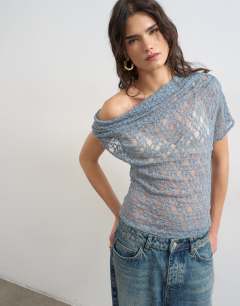Model wearing Lace fallen shoulder top in blue