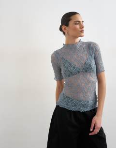Model wearing Lace fitted high neck half sleeve top in blue