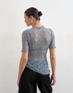 Model wearing Lace fitted high neck half sleeve top in blue