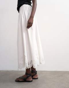 Model wearing Lace hem full circle maxi skirt in ivory