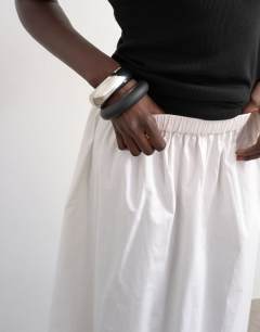 Model wearing Lace hem full circle maxi skirt in ivory