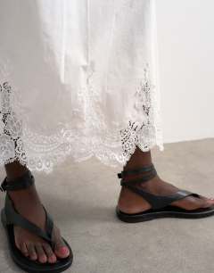 Model wearing Lace hem full circle maxi skirt in ivory