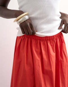 Model wearing Lace hem full circle maxi skirt in red