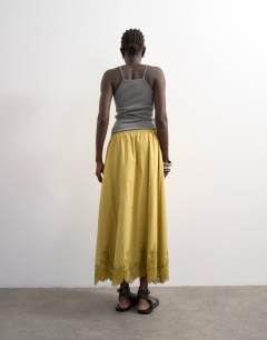Model wearing Lace hem full maxi skirt in lime