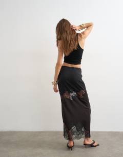 Model wearing Lace insert column maxi skirt in brown and black
