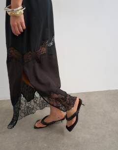 Model wearing Lace insert column maxi skirt in brown and black