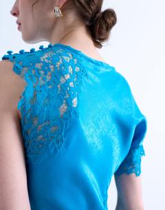 Model wearing Lace insert grown on shoulder midi dress in deep blue