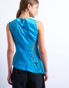 Model wearing Lace insert grown on shoulder top in deep bue