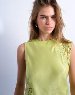 Model wearing Lace insert grown on shoulder top in lime