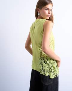 Model wearing Lace insert grown on shoulder top in lime