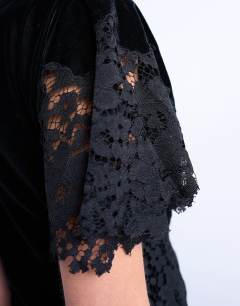 Model wearing Lace insert grown on shoulder velvet mini dress in black