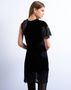 Model wearing Lace insert grown on shoulder velvet mini dress in black