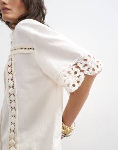 Model wearing Lace insert resort shirt in ivory