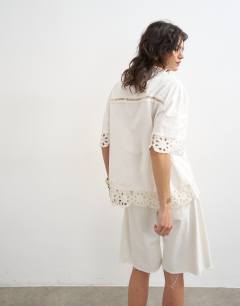 Model wearing Lace insert resort shirt in ivory
