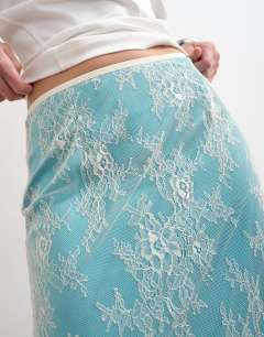 Model wearing Lace midi skirt with blue insert in ecru