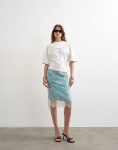 Model wearing Lace midi skirt with blue insert in ecru