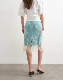Model wearing Lace midi skirt with blue insert in ecru
