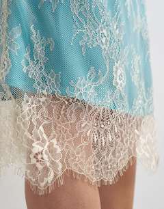 Model wearing Lace midi skirt with blue insert in ecru