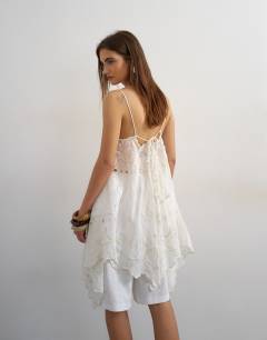 Model wearing Lace panel cami with embroidery detail in white