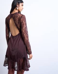 Model wearing Lace sleeve flippy hem mini dress in port royale