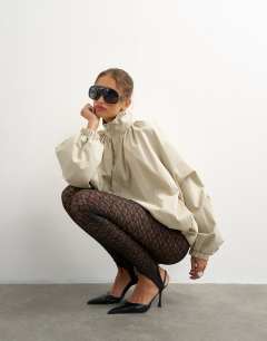 Model wearing Lace stirrup leggings in black