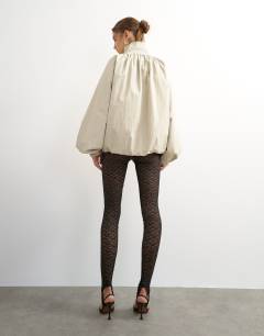 Model wearing Lace stirrup leggings in black