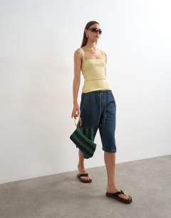 Model wearing Lace trim cami in yellow