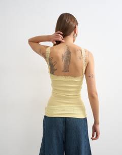 Model wearing Lace trim cami in yellow