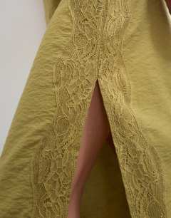 Model wearing Lace trim maxi skirt in olive green