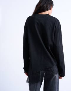 Model wearing Lace trim oversized skater tee in black