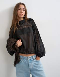 Lace trim ruched side blouse in black