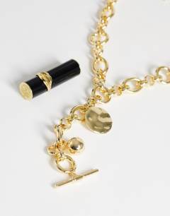 Model wearing Lana oversized chain necklace with charms in gold tone